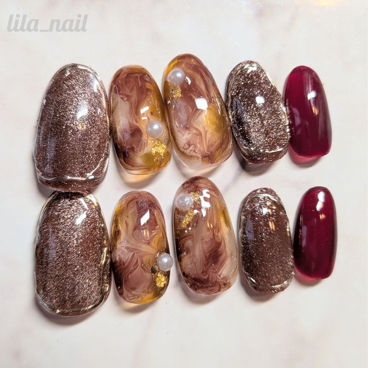 Brown magnetic nail tips, perfect for creating a nuanced, autumnal, marble, or burgundy look. (Full size)