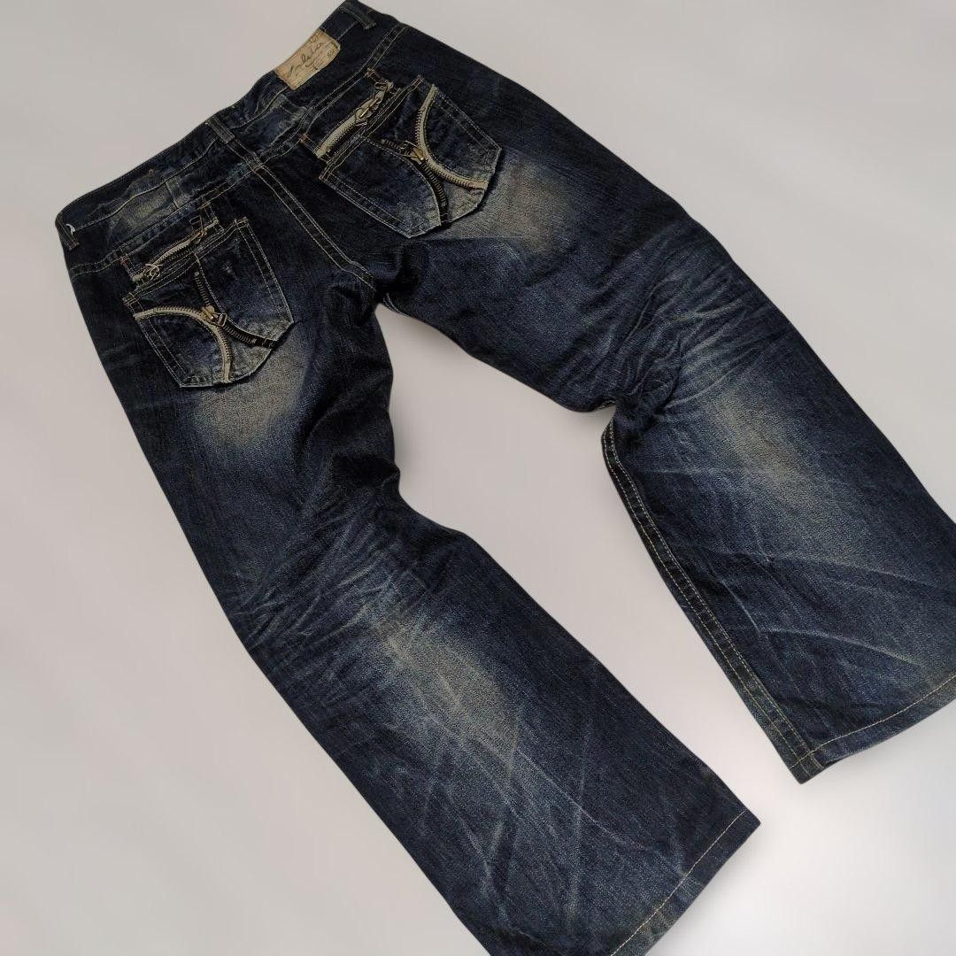 Preview of LOLITA JEANS Y2K Denim Pants W34, with heavy whiskering and honeycomb pattern.