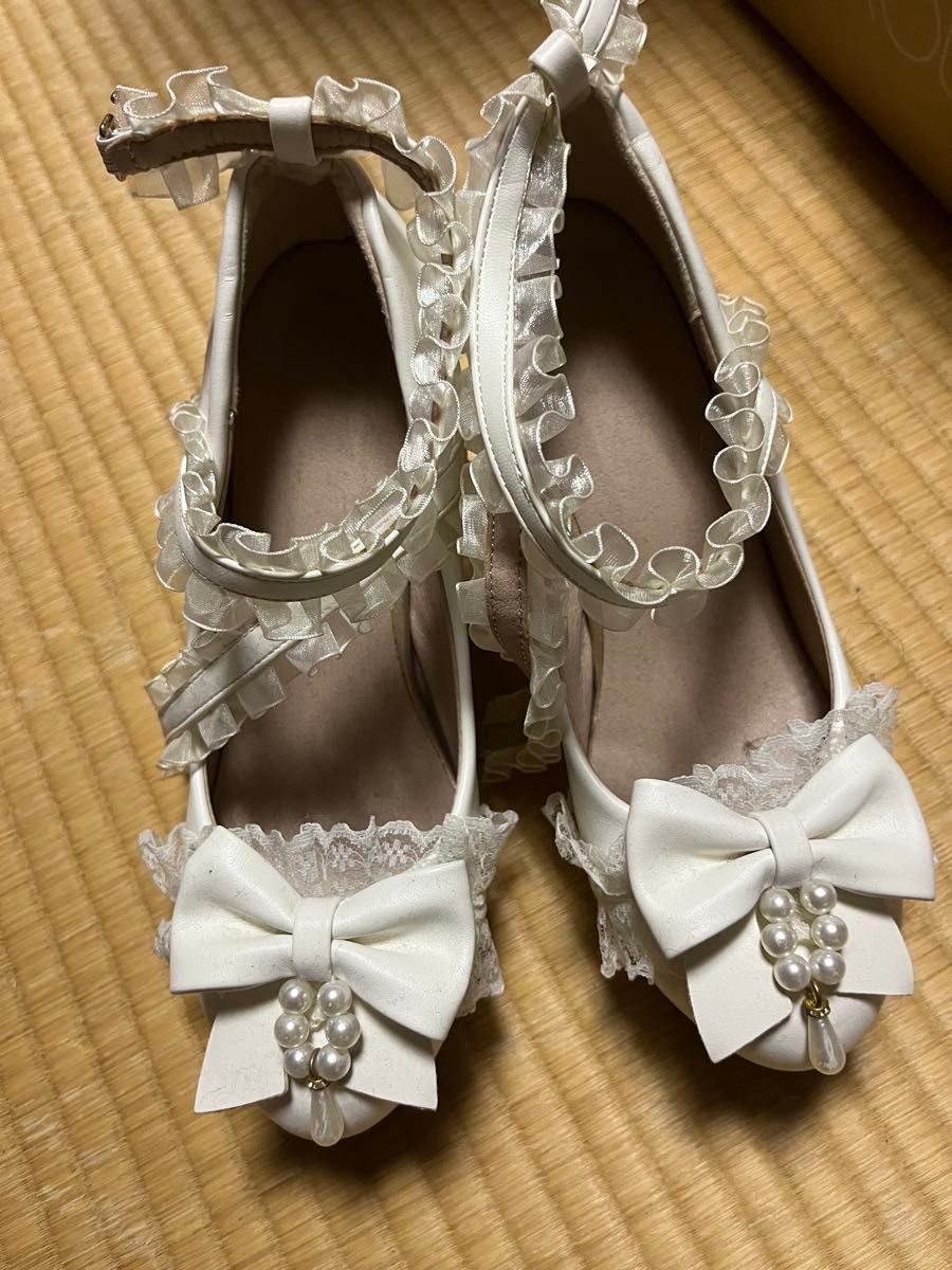 Preview of Lolita-style ribbon-detailed strap pumps with pearl embellishments, white.