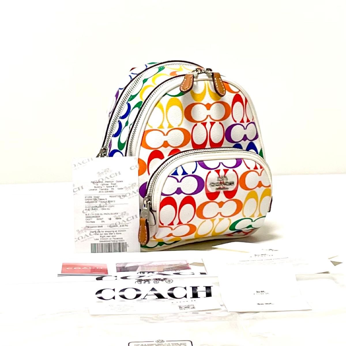 レディース COACH リュック カーゴ NEW YORK シグネチャー柄 ベージュ 